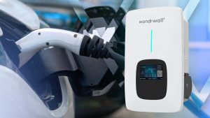 Wondrwall electric vehicle charger next to a car being electrically charged